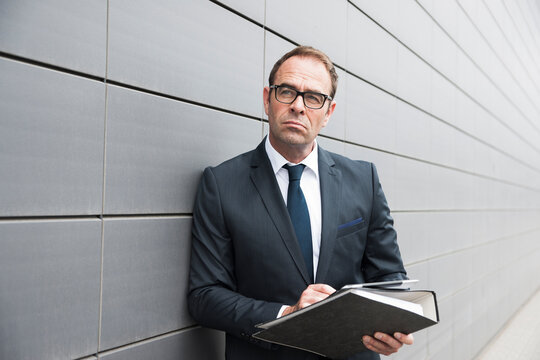 Portrait of Businessman using Tablet Computer Outdoors, Mannheim, Baden-Wurttemberg, Germany