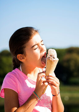 Girl eating Ice Cream Cone, Lampertheim, Hesse, Germany