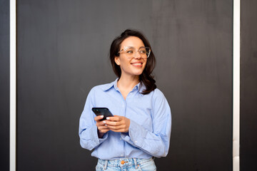 Woman use smartphone isolated on black