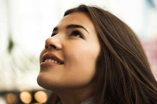Close-up portrait of teenage girl looking upward, Germany