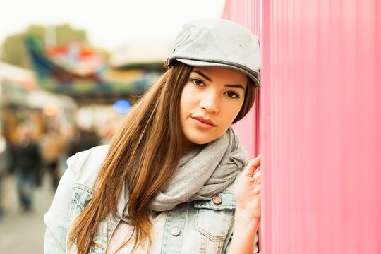 Close-up portrait of teenage girl wearing hat at amusement park, looking at camera, Germany