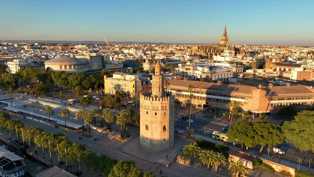 Aerial drone footage of the Seville city the Guadalquivir canal with the cathedral, the Torre del Oro, the tower of gold, Andalusia, Spaine