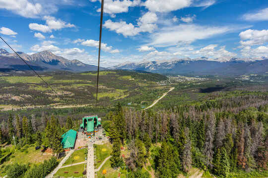 Aerial view of Jasper and the Skytram lower station from a Skytram cabin in Jasper National Park; Jasper, Alberta, Canada