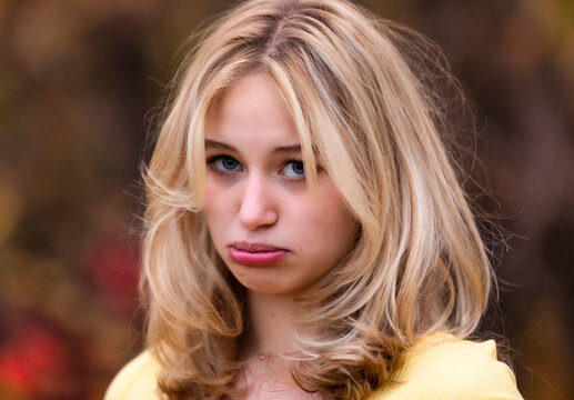 Portrait of a beautiful young teenage girl with a big frown on her face; St. Albert, Alberta, Canada