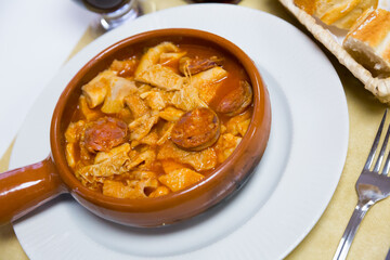 Dish of Spanish cuisine – stew with beef tripe and blood sausage chorizo