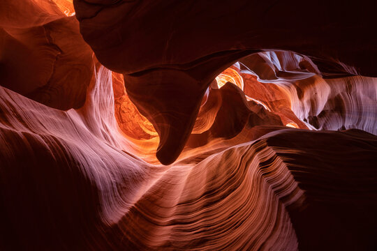 Slot canyon near Page, Arizona. The wind and water create amazing striations in the sandstone in a stunning example of erosion; Page, Arizona, United States of America