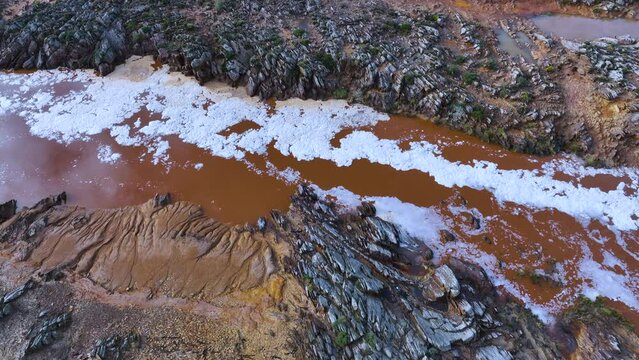 Rio Tinto textures. Aerial view from a drone in the surroundings of the town of Berrocal. Sierra Morena, Gulf of C&aacute;diz, Huelva, Andalusia, Spain, Europe