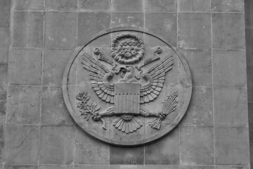 US national coat of arms on chapel wall in American military cemetery of World War 2. Hamm, Luxembourg - April 10, 2023. 