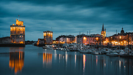 Fototapeta na wymiar beautiful illuminated cityscape of the old harbor of La Rochelle