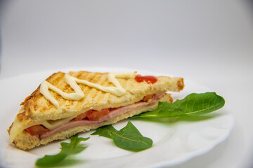 Sandwich with ham, cheese, tomatoes, and toasted bread...homemade sandwiches on white background...