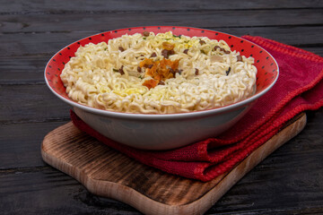 Instant vermicelli in a plate with seasoning.