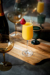Mimosa with Strawberry Garnish in Decorative Setting