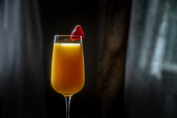 Mimosa with Strawberry Garnish in Decorative Setting