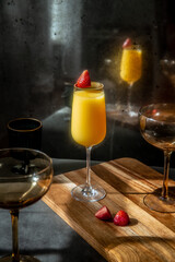 Mimosa with Strawberry Garnish in Decorative Setting