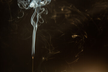 white smoke in interesting vortex pattern on black background. illustration for smoking, air...