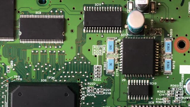 large microcircuits on a printed circuit board macro photography, movement