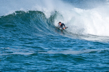 Bodyboarder surfing ocean wave