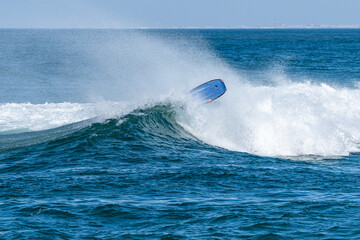 Bodyboarder surfing ocean wave