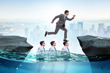 Inequal competition concept with businessman walking on heads
