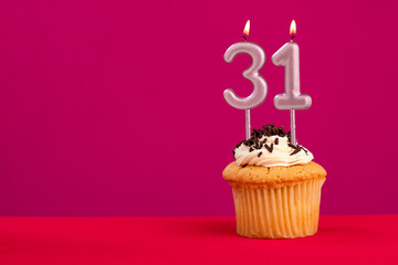 Candle number 31 - Cake birthday in rhodamine red background
