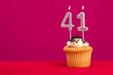 Candle number 41 - Cake birthday in rhodamine red background