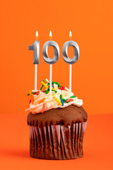 Birthday cake with candle number 100 - Orange foamy background