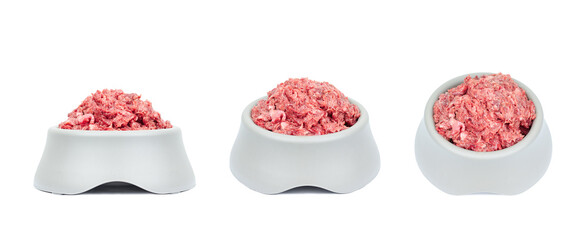 Natural fresh raw meat food in pet bowl from different angles isolated on white
