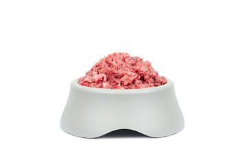 Fototapeta na wymiar Natural dog food. Raw minced meat in bowl isolated on white background