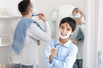 Obraz premium Morning of little boy and his father shaving in bathroom