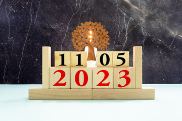 day on the calendar, May 11 on wooden block