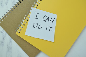 Concept of I Can Do It write on book isolated on Wooden Table.
