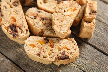 Delicious biscotti cookies on wooden background, closeup