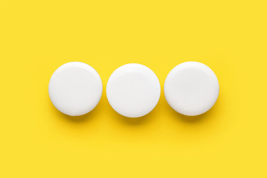 Blank white badges on yellow background