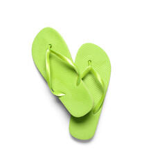 Pair of green flip-flops on white background