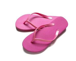 Pair of pink flip-flops on white background