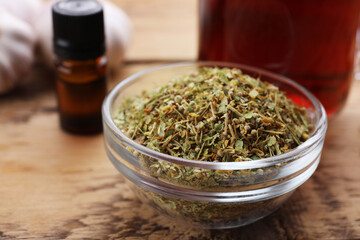 Cold remedies. Glass bowl of tea on wooden table, closeup. Cough treatment