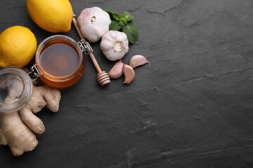 Cold remedies on black table, flat lay and space for text. Cough treatment