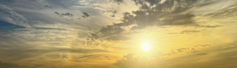 Sun shining on beautiful cloudy sky at sunset, banner design