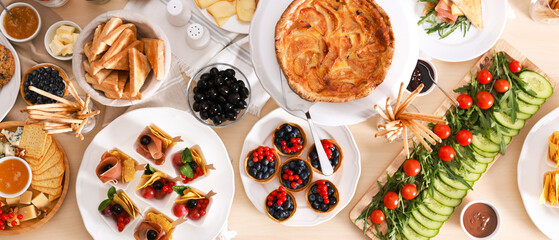 Different tasty food for brunch on wooden table, flat lay. Banner design
