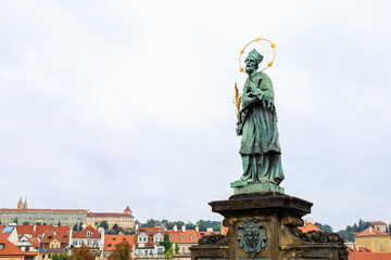 Ancient medieval sculptures on the Charles Bridge. Background with selective focus