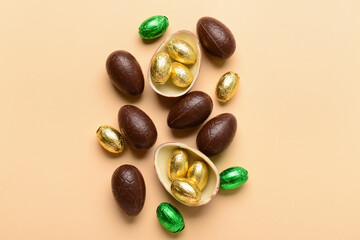 Chocolate Easter eggs on beige background