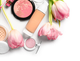 Obraz na płótnie Canvas Decorative cosmetics with tulips on white background
