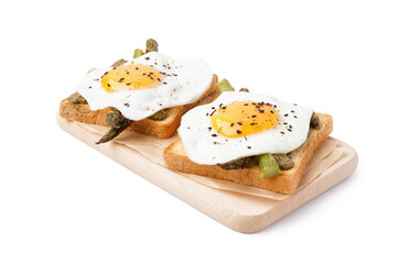 Delicious sandwiches with fried eggs and asparagus on white background