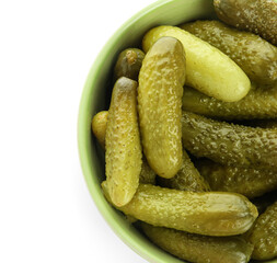 Bowl with tasty fermented cucumbers on white background
