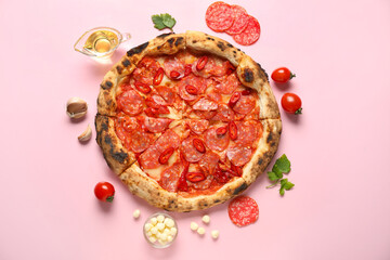 Delicious pepperoni pizza and ingredients on pink background
