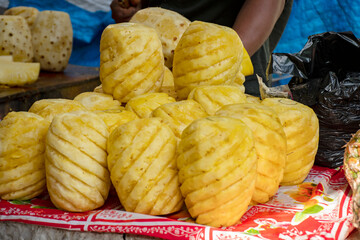 A man of muslim religion selling pineapple fruits at the Zakaria street at the time of Ramadan.