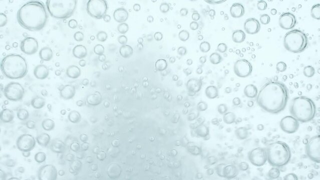 Top view closeup scene on chaotic moving pattern of bubble isolated on white background, texture of soda water when gas release, fizz medical drink from antacid pill, air of oxygen tank in diving