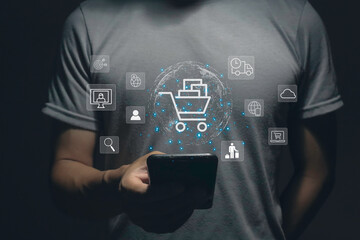 Young man using smartphone with shopping cart icon, Online shopping and e-commerce concept.