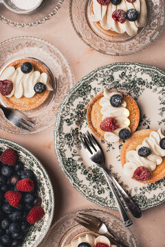 Lemon curt tartlets on a decorative plate