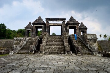 Fototapeta na wymiar Yogyakarta, Indonesia – January 16, 2020: Restored Temple Ruins Of Candi Ratu Boko Is Not A Temple, But A Remains Of A Palace. Ratu Baka Is Often Called Kraton Ratu Boko. Built During The 8th Century